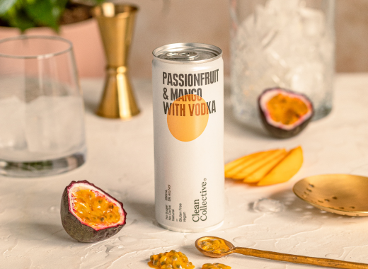 an of Clean Collective low-calorie premixed vodka drink garnished with fresh fruit.